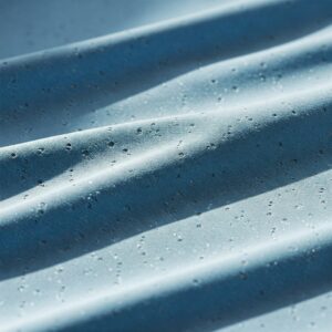 Close-up view of the breathable, moisture-wicking fabric in long sleeve golf shirts.