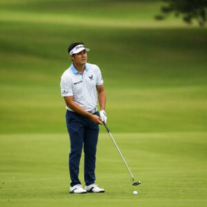 Golfer swinging Top Flite Golf Clubs during a game 