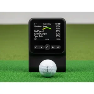 A compact, portable best launch monitors for golf placed behind a golf ball on a practice mat, ready to track swing data for on-the-go analysis.