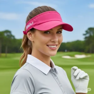 A female golfer modeling a pink golf visor, perfect for adding a touch of style to her golf attire.