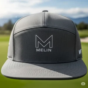 Close-up front view of a classic Melin golf hat, highlighting its structured crown and signature logo detail, perfect for on and off the golf course.