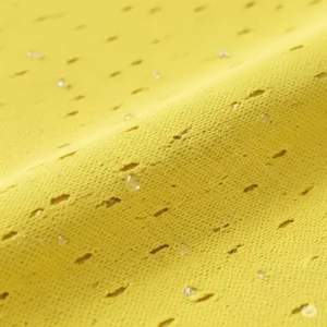 A detailed illustration showing the breathable, moisture-wicking fabric texture of a high-performance yellow golf shirt.