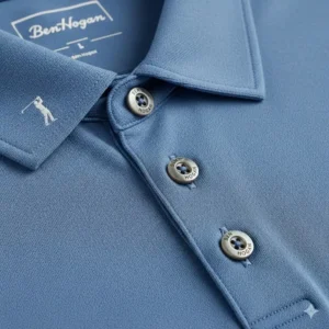 A detailed view of the high-quality collar and button placket of a Ben Hogan golf shirt.