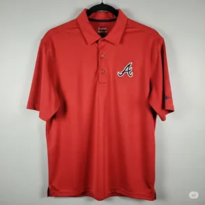 An atlanta braves golf shirt hanging neatly, providing a clear view of the entire polo.