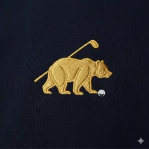 A close-up of the embroidered Golden Bear logo on a jack nicklaus golf shirt.