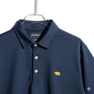 A clean shot of a jack nicklaus golf shirt hanging on a white background, highlighting its design.