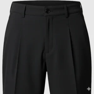 A close-up, front-facing view of black pleated golf shorts. The image highlights the detailed pleats and flat waistband. 