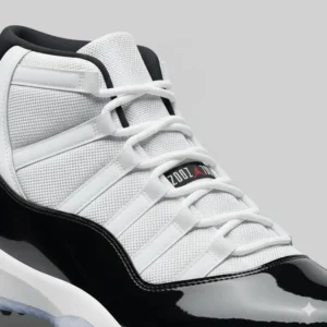 Close-up of the premium upper materials, including patent leather, used in the design of the jordan 11 golf shoes
