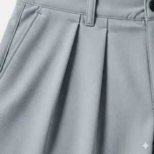 A close-up shot of the breathable, moisture-wicking fabric used in pleated golf shorts. The detail shows the lightweight material.