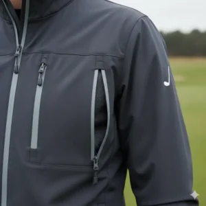 A detailed shot of the zippers, pockets, and adjustable cuffs on a windproof wind jackets golf.