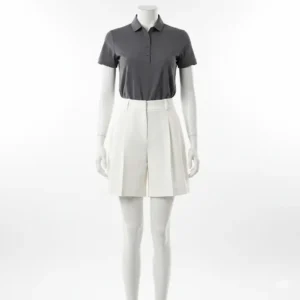 A mannequin modeling high-waisted pleated golf shorts, emphasizing the flattering fit and style.