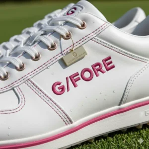 Close-up of the subtle G/FORE brand logo and stylish accent detailing on the side of the women's golf shoes.