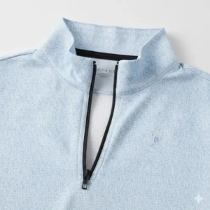 Detailed view of the quarter-zip and breathable mesh panel on an ibkul golf sun protection shirt.