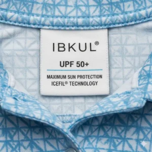 Fabric tag on an item of ibkul golf clothing clearly displaying the UPF 50+ sun protection rating.