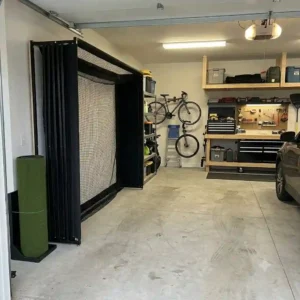 A space-saving and compact garage golf practice setup perfect for residential use.